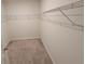 Walk-in closet with neutral walls and wire shelving for ample storage space at 2479 White Lilly Dr, Kissimmee, FL 34747