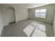 Bright living room with tile floors and modern light fixture at 2479 White Lilly Dr, Kissimmee, FL 34747