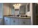 Bathroom featuring a long dual-sink vanity with great storage space at 2646 Quarterdeck Ct, Kissimmee, FL 34743