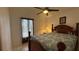 Bedroom with a patterned bedspread and a small window at 2646 Quarterdeck Ct, Kissimmee, FL 34743