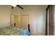 Bright bedroom with access to the hallway and a closet at 2646 Quarterdeck Ct, Kissimmee, FL 34743