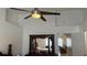 Bedroom with queen-sized bed and dresser with mirror; modern ceiling fan overhead at 2646 Quarterdeck Ct, Kissimmee, FL 34743