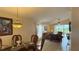 The dining room features a glass-top table with wicker chairs and decorative lighting at 2646 Quarterdeck Ct, Kissimmee, FL 34743