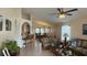 Open-concept living area showcases archway to kitchen, vaulted ceiling and dining area at 2646 Quarterdeck Ct, Kissimmee, FL 34743