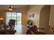 Living room showcasing an open floor plan, ceiling fan and a view of the pool at 2646 Quarterdeck Ct, Kissimmee, FL 34743