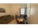 Comfortable living room featuring a futon and an armchair at 2646 Quarterdeck Ct, Kissimmee, FL 34743