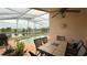 Relaxing outdoor patio with dining and a pool, great for entertainment at 2646 Quarterdeck Ct, Kissimmee, FL 34743