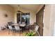 Covered patio with ceiling fan, tile flooring and outdoor dining table, perfect for relaxing and entertaining at 2646 Quarterdeck Ct, Kissimmee, FL 34743
