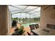 Outdoor patio seating with a pool and lake view at 2646 Quarterdeck Ct, Kissimmee, FL 34743