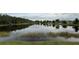 Beautiful panoramic view of the backyard pond at 2646 Quarterdeck Ct, Kissimmee, FL 34743