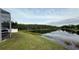 Backyard view of a beautiful pond, accessible from the home at 2646 Quarterdeck Ct, Kissimmee, FL 34743