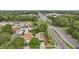 This aerial view shows a residential neighborhood with tree-lined streets and easy access to nearby amenities and roads at 2700 Palm Isle Way, Orlando, FL 32829
