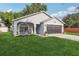Well-maintained one-story home with a front porch and green lawn on a sunny day at 2700 Palm Isle Way, Orlando, FL 32829