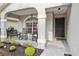 Inviting front porch with rocking chairs and a small table, perfect for relaxing at 2700 Palm Isle Way, Orlando, FL 32829