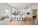 Modern kitchen with white cabinetry, black countertops, and a breakfast bar with seating at 2700 Palm Isle Way, Orlando, FL 32829