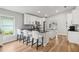 Bright kitchen features white cabinets, stainless steel appliances, and a breakfast bar with seating for three at 2700 Palm Isle Way, Orlando, FL 32829