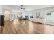 Large living room with wood flooring, white walls, and workstation at 2700 Palm Isle Way, Orlando, FL 32829