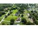 Aerial view showing property lines marking 3 acres with lush greenery and surrounding neighborhood at 2851 Granada Blvd, Kissimmee, FL 34746