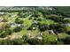 Aerial view of a large, well-maintained property with mature trees in a serene residential neighborhood at 2851 Granada Blvd, Kissimmee, FL 34746