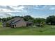 Lush backyard with a screened-in lanai, outdoor seating, and a play area for children at 2851 Granada Blvd, Kissimmee, FL 34746