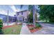 Beautiful yard with landscaping, fence, and screened-in porch on a two-story home at 2851 Granada Blvd, Kissimmee, FL 34746