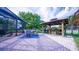 Expansive backyard patio with an outdoor bar and screened-in pool area perfect for relaxation at 2851 Granada Blvd, Kissimmee, FL 34746