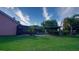 Expansive backyard with a patio, a screened pool, and a rustic outdoor bar area for entertainment at 2851 Granada Blvd, Kissimmee, FL 34746