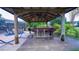 Outdoor patio bar with seating, perfect for entertaining, with view of pool at 2851 Granada Blvd, Kissimmee, FL 34746