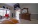 A stylish bedroom featuring a decorative mirror, flatscreen tv and a bright seating area at 2851 Granada Blvd, Kissimmee, FL 34746