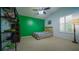 Well-lit bedroom with a bed, large window, and unique decorative shelf at 2851 Granada Blvd, Kissimmee, FL 34746