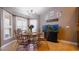 Breakfast nook with bay windows, decorative chandelier, and a large fish tank at 2851 Granada Blvd, Kissimmee, FL 34746