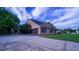 Spacious driveway leading to attached garage and well-maintained property exterior at 2851 Granada Blvd, Kissimmee, FL 34746