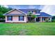 Beautiful two-story home with lush lawn, well-maintained landscaping, and inviting front entrance at 2851 Granada Blvd, Kissimmee, FL 34746