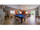 Spacious game room featuring a pool table, foosball, and stylish decor at 2851 Granada Blvd, Kissimmee, FL 34746