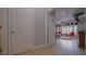 Hallway view leading into a main bedroom with hat decorations and large mirror at 2851 Granada Blvd, Kissimmee, FL 34746