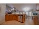 Open concept kitchen with stainless steel dishwasher and granite countertops at 2851 Granada Blvd, Kissimmee, FL 34746