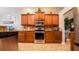 Gourmet kitchen with custom cabinets and stainless steel appliances at 2851 Granada Blvd, Kissimmee, FL 34746