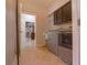 Functional laundry room with modern washer/dryer and storage cabinets at 2851 Granada Blvd, Kissimmee, FL 34746