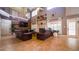 The living room is open and spacious, with a fireplace and large windows that let in plenty of light at 2851 Granada Blvd, Kissimmee, FL 34746