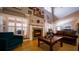 Bright living room with soaring ceilings, shutters, cozy fireplace, and an open floor plan at 2851 Granada Blvd, Kissimmee, FL 34746