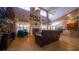 Spacious living room with soaring ceilings, fireplace, and seamlessly integrates with the open-concept kitchen at 2851 Granada Blvd, Kissimmee, FL 34746