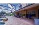 Spacious, screened-in back patio with comfortable seating and a picturesque view of the pool and backyard at 2851 Granada Blvd, Kissimmee, FL 34746