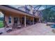 Covered back patio with comfortable seating overlooking the refreshing screened-in pool at 2851 Granada Blvd, Kissimmee, FL 34746