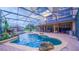 Inviting pool with rock features and screened lanai for year-round enjoyment at 2851 Granada Blvd, Kissimmee, FL 34746