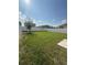 Expansive backyard featuring a full fence and green lawn space for entertaining at 2915 Turnstone, St Cloud, FL 34773