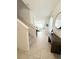 Inviting foyer with stairs, tiled flooring, a stylish console table, and ample natural light at 2915 Turnstone, St Cloud, FL 34773