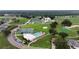 Wonderful aerial view of the community with pool, tennis courts, golf course and clubhouse at 3161 Timberly Ln, Lakeland, FL 33810
