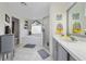 Bright bathroom with tile flooring, vanity, and updated lighting at 3161 Timberly Ln, Lakeland, FL 33810