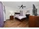 Bedroom with hardwood floors, ceiling fan and neutral wall color at 3161 Timberly Ln, Lakeland, FL 33810