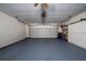 Clean two-car garage with epoxy flooring and built-in storage cabinets at 3161 Timberly Ln, Lakeland, FL 33810